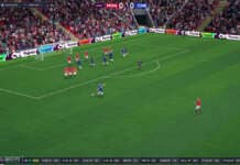 Football Manager 26 logo accanto al marchio FIFA con sfondo stadio